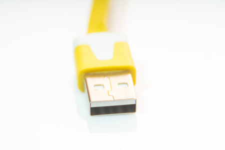the yellow mobile charger for the mobile phone]の写真素材
