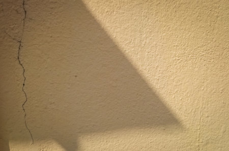 the light and shadow in cement wallの写真素材