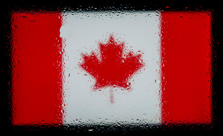 Drops of water on Canada flag background. Shallow depth of field. Selective focus. Toned.の写真素材