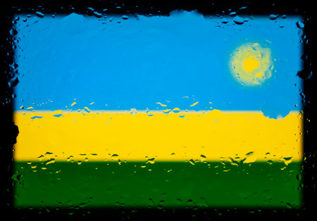 Drops of water on Rwanda flag background. Shallow depth of field. Selective focus. Toned.の写真素材