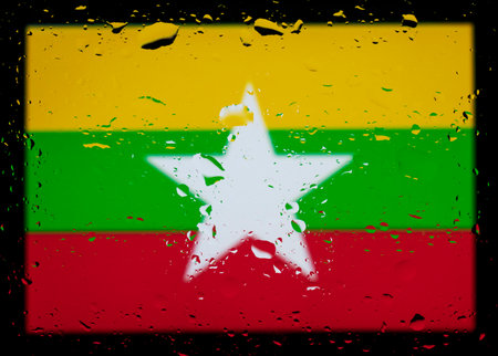 Drops of water on myanmar flag background. Shallow depth of field. Selective focus. Toned.の写真素材