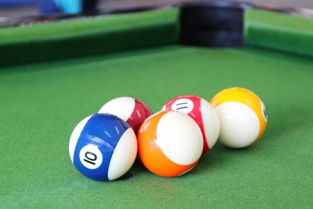 Closed up Billiard balls on a pool table