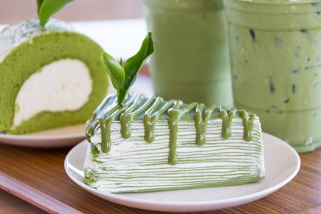 Closed up Green tea cake roll and crepe cake with matcha green teaの写真素材