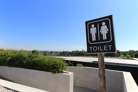 Toilet sign and blue sky backgroundの写真素材