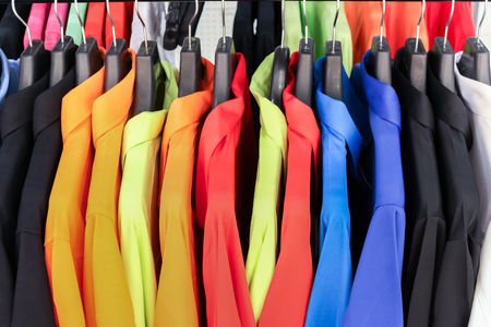 Colorful shirts hanging for your color style, select it.の写真素材