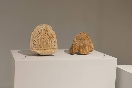 Prachin buri, Thailand - August 26, 2019: Baked clay Bas-relief of Human faced figure Dvaravati art...