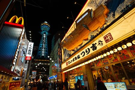 Osaka, Japan - December 15, 2019 : The famous Tsutenkaku Tower of Osaka city and Shinsekai shopping street, this is the travel destinations of Shinsekai district, Osaka city in Kansai area of Japan.