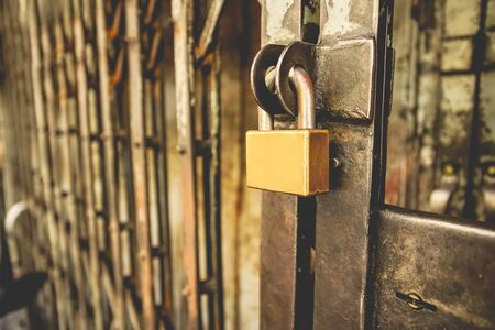Locked padlock outside of the store old building, for security or safety concept.