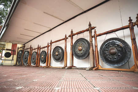The ancient big Gongs in Wat Phra Pathomchedi, Nakhon Pathom Province, Thailand.の写真素材