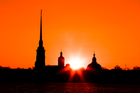 Peter and Paul Fortress of St. Petersburg, Russia in the rays of setting sun. The Peter and Paul Fortress is the original citadel founded by Peter the Great in 1703 and built to Trezzini's designsの写真素材