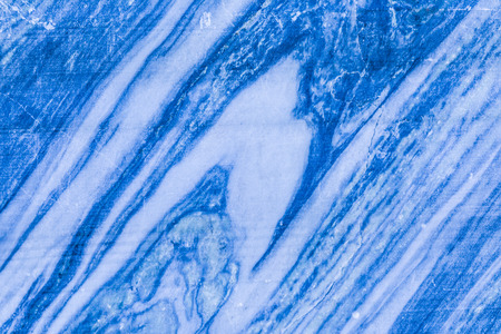 The background or texture of the marble wall of the quarry or opencast. The surface of the marble stone or rockの写真素材