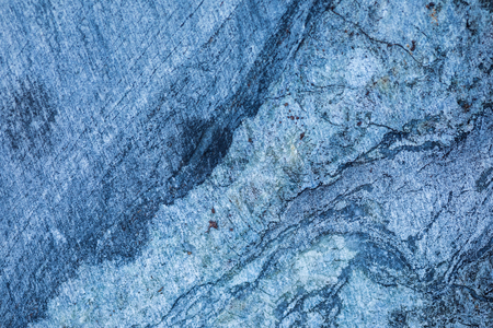 The background or texture of the marble wall of the quarry or opencast. The surface of the marble stone or rockの写真素材