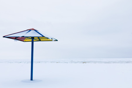 Alone sunshade on the winter beachの写真素材
