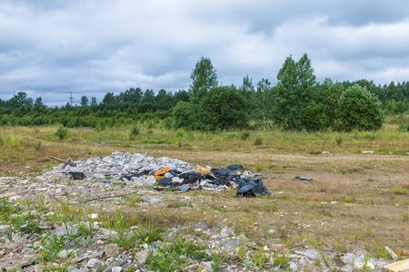 Unauthorized dump of garbage amongの写真素材