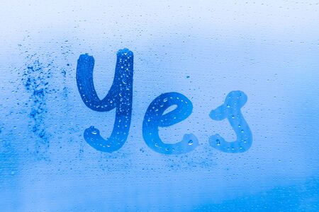 Yes inscription on window glassの写真素材