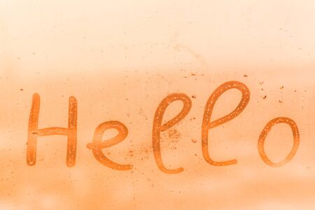 Hello inscription on window glass