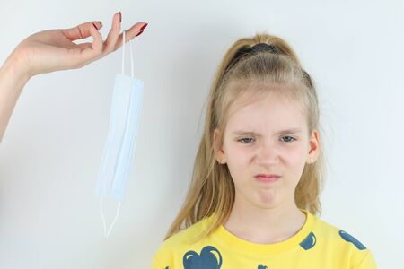 Girl refuses to wear medical mask and mother hand