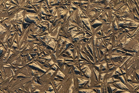 Beautiful colorful, bright and vivid background or texture of mud, slush or muck with ice in cold...
