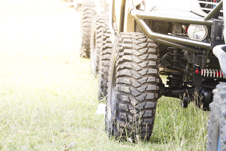 Off-road car parked at the lawn at sunset.の写真素材