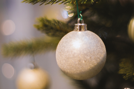 Soft focused on white  ball Christmas celebration accessories on Christmas tree prepare for the Christmas and happy New Year festivalの写真素材