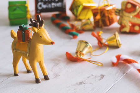 Christmas reindeer bring the gift box to people in Christmas night.の写真素材