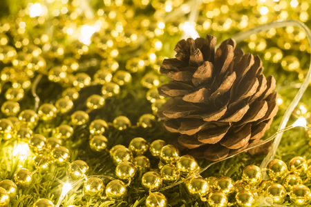 Pine cones and Christmas party accessories on wooden tableの写真素材