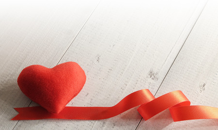 Red fabric heart on wooden background ,Valentines day background or Wedding day partyの写真素材