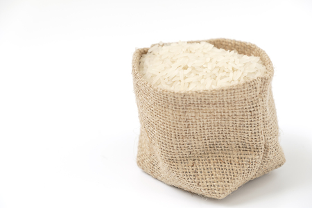 Rice in sack on white backgroundの写真素材