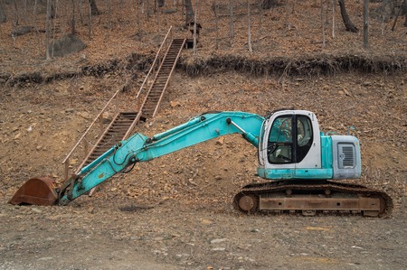 Excavator on quarry development in the forestの写真素材