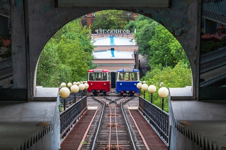 Wagons of Vladivostok Funicular take the tourists to observation platform. The word is written in...