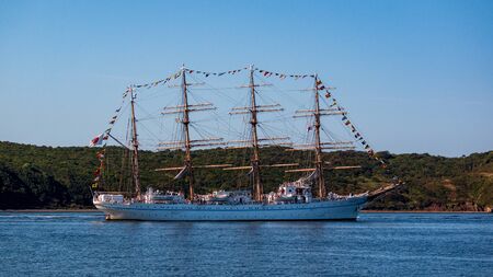 VLADIVOSTOK, RUSSIA - SEPTEMBER 11, 2018: The movement of sailing ship aiwo Maru in the Amur Bay of the Bosporus Easern strait in the background of the Russian Island during the preparation for the sailing regatta in Vladivostok.のeditorial素材