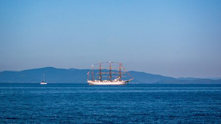 VLADIVOSTOK, RUSSIA - SEPTEMBER 11, 2018: The movement of sailing ship aiwo Maru in the Amur Bay of the Bosporus Easern strait near the Russian Island during the preparation for the sailing regatta in Vladivostok.のeditorial素材
