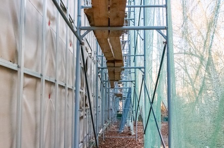 Construction site restoration work on the renovation of the old facade of the building of Soviet...