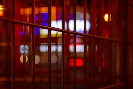 Urban night illumination background with artificially blurred neon and led lighting of buildings and...