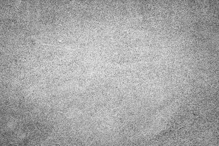 Grunge concrete background with a vignette and a porous texture in the form of small dots resembling graniteの写真素材