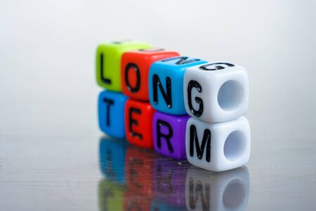 Conceptual of long term balance sheet items in financial statements spelled on alphabet beads....