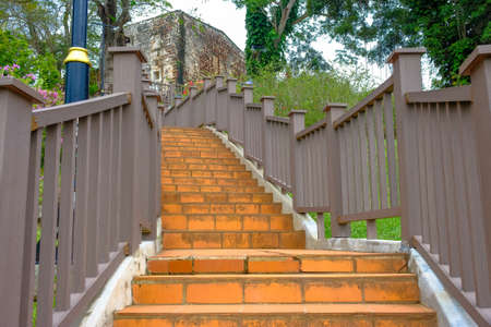Low angle image of staircase with railing to peak of st paul hill to a famosa, former Portuguese...