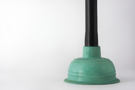 Rubber plunger with plastic handles on a dark backgroundの写真素材
