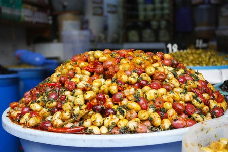 Mixed olives with spices in a market in Casablanca. Typical local cultivationの写真素材