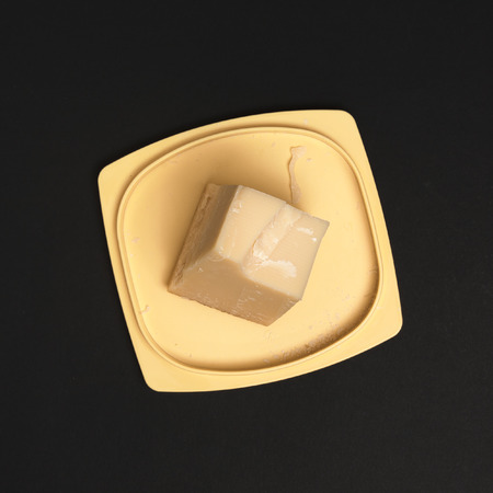 Cheese on a black background to mean a concept of nutrition and businessの写真素材