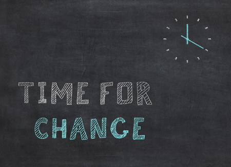 Time for Change - clock with text on black background to mean a conceptの写真素材