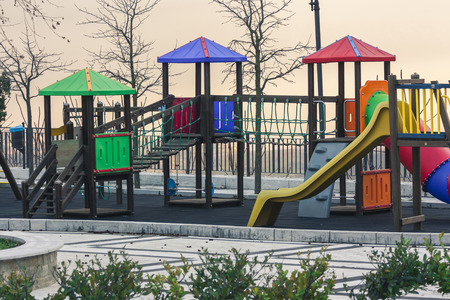 Colorful playground on yard in the park to mean a concept