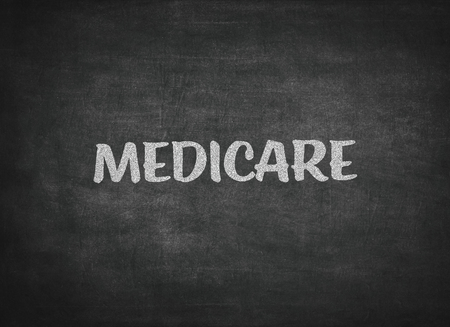 The word medicare written on a blackboardの写真素材
