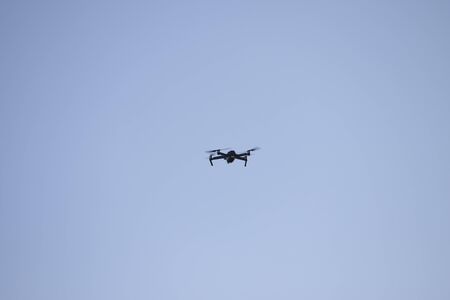 flying drone with the camera in the skyの写真素材