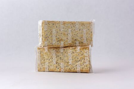 Matera, Italy - May 26, 2019: Crackers on a white background to mean a business conceptのeditorial素材
