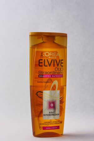 Matera, Italy - May 29, 2019: Elvive nourishing shampoo on a white background to mean a commercial conceptのeditorial素材