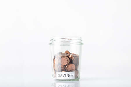Euro cents with the inscription SAVINGS on a white backgroundの写真素材