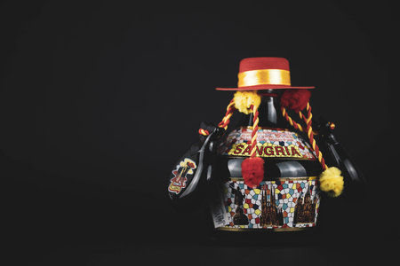 Rome, Lazio, Italy - October 12, 2022: Small sangria bottle on a black background.のeditorial素材