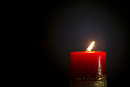 Red Candle in blackの写真素材