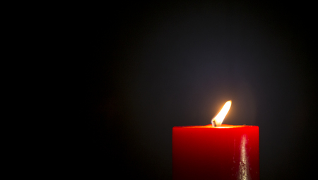 Red Candle in blackの写真素材